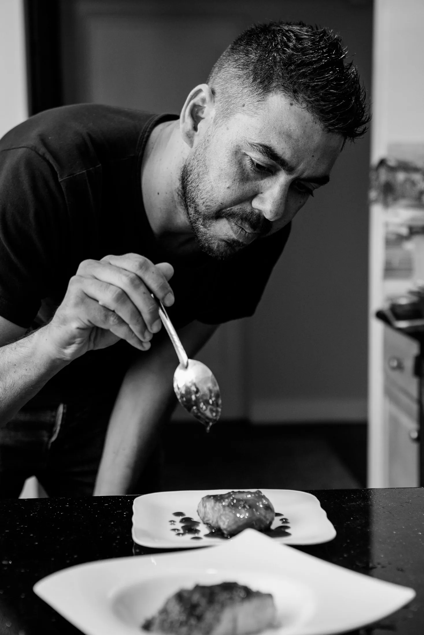 Yossi, food designer, working in the kitchen
